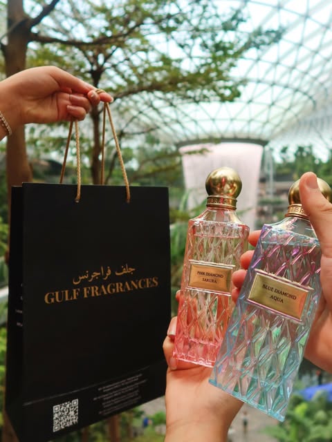 Gulf Fragrances shopping bag and two perfume bottles at Jewel